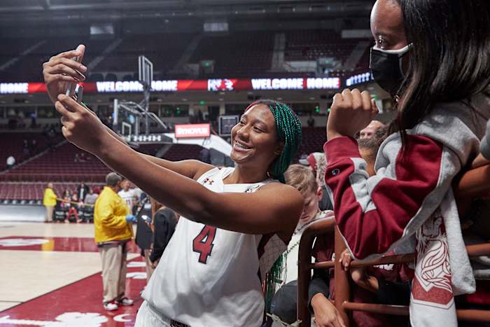 South Carolina star Aliyah Boston takes a selfie with a Gamecocks fan.
